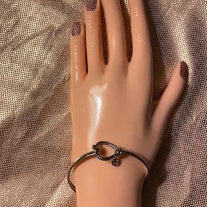 Bracelet silver colored with dangling jewel hook closure